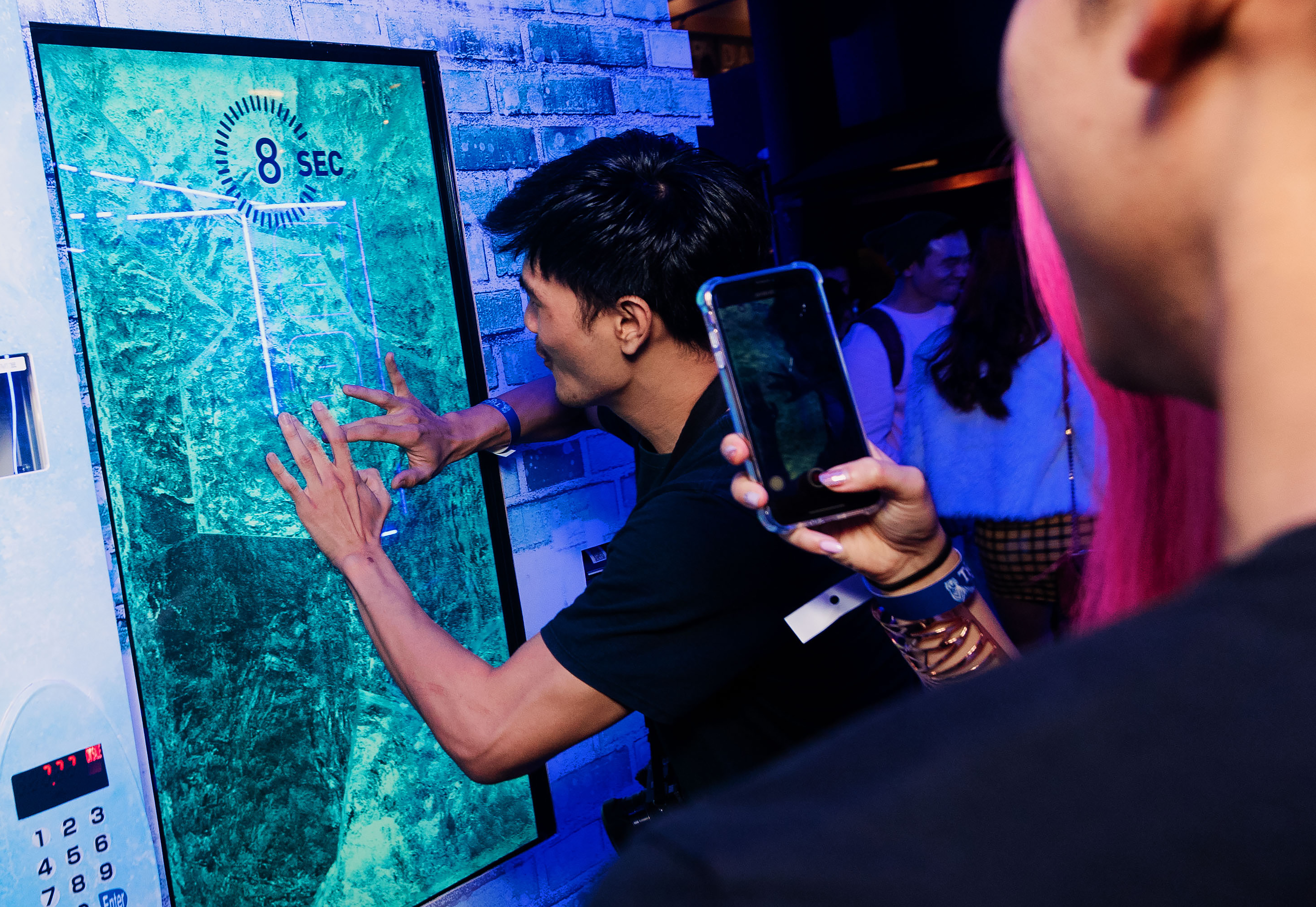 27. Guests trying out the interactive activity at the launch of Tiger Crystal-v2