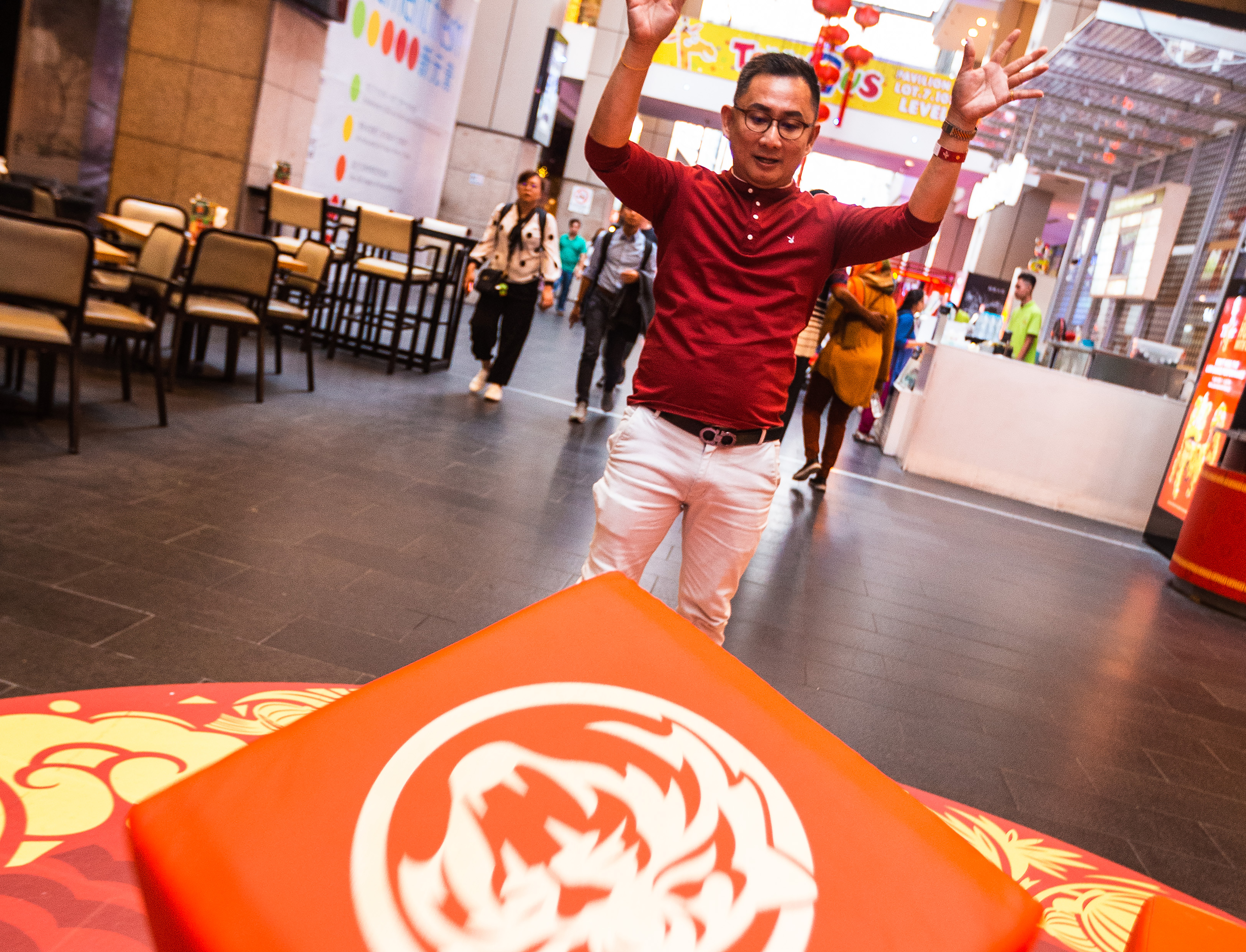 A guest trying his hand at the Double Golden Tigers game at Pavilion KL, Connection-v2