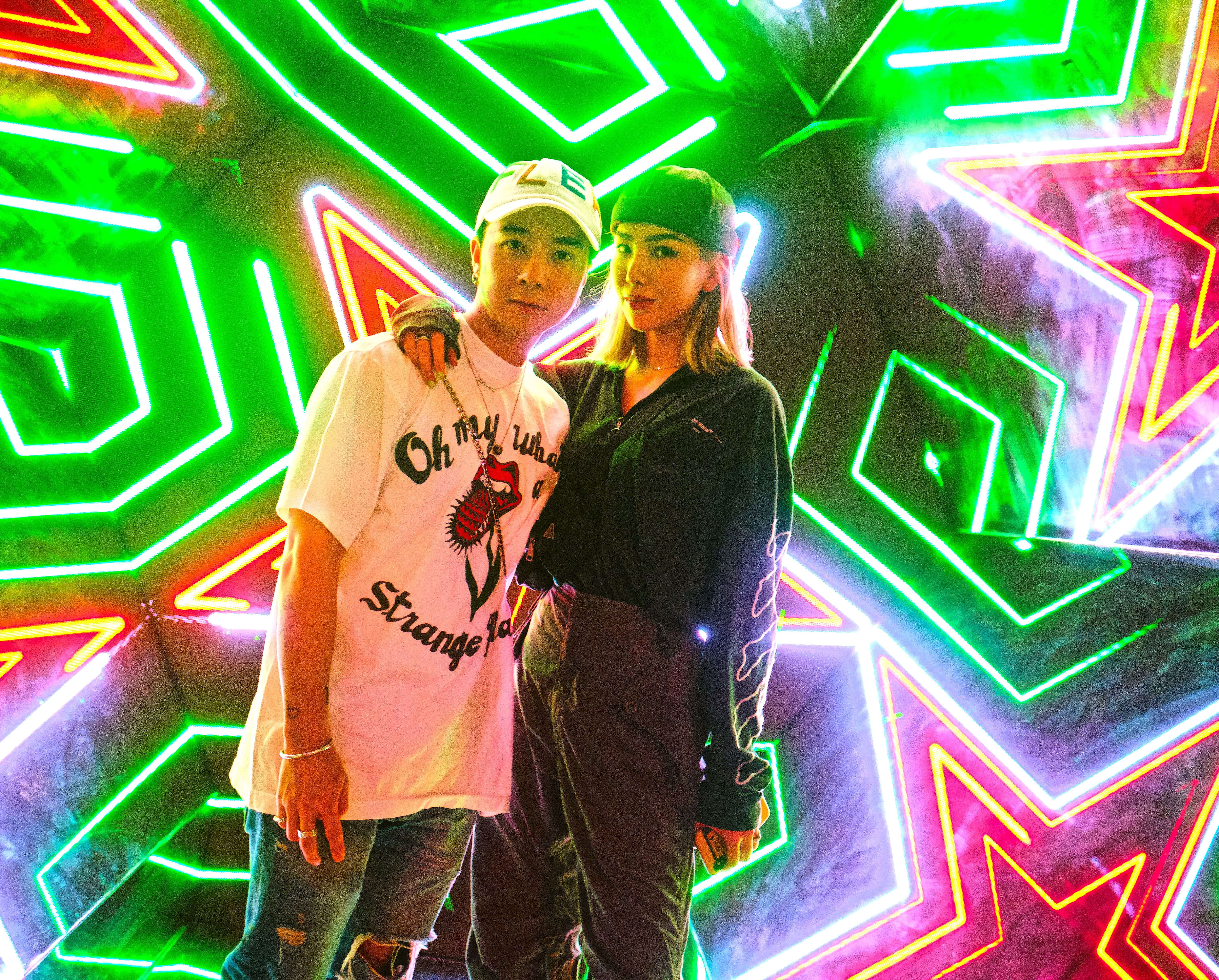 Guests (DJ Blink and Ashley Lau) experiencing the Heineken® kaleidoscope photo booth-v2
